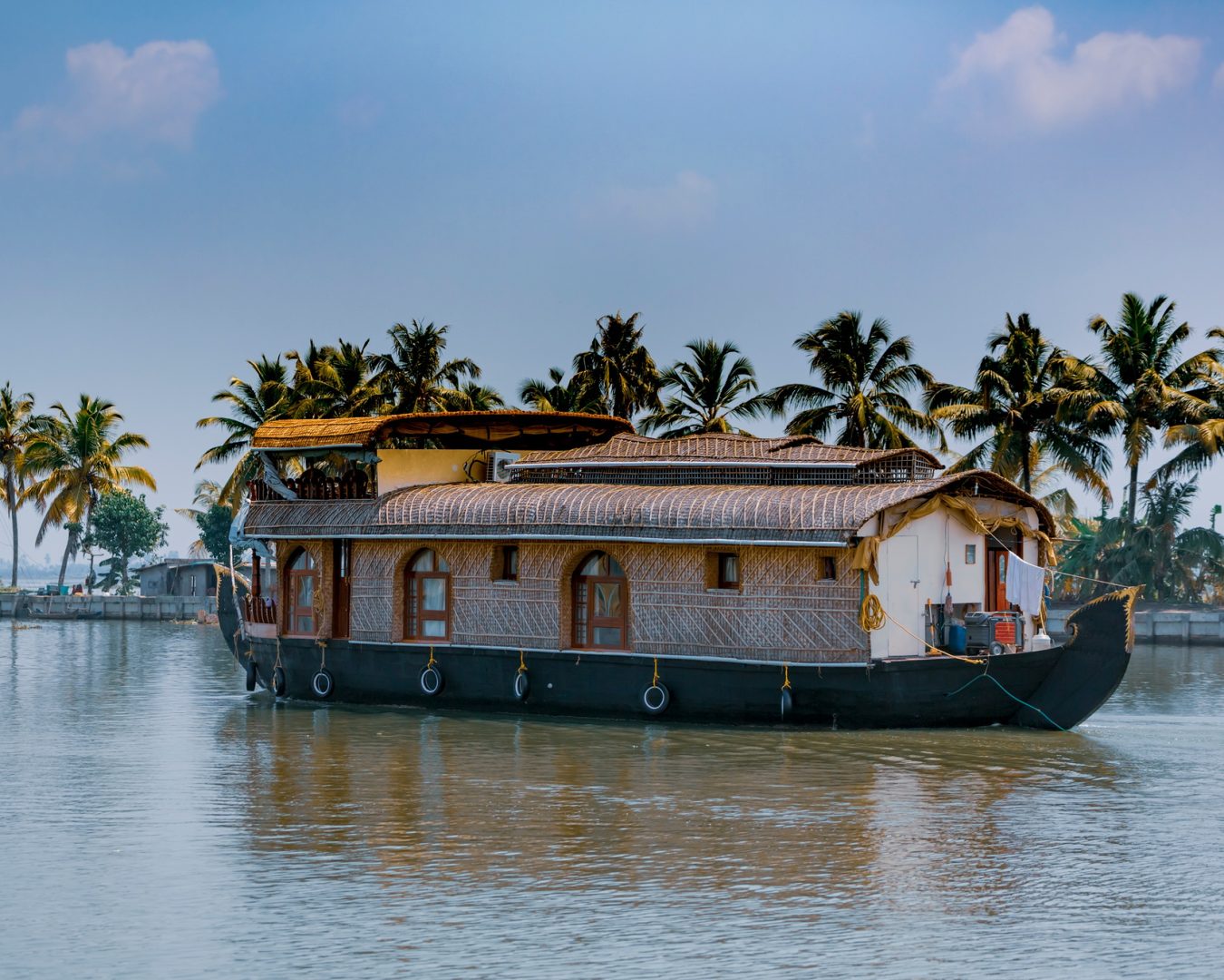 House boat sailing through Kerala backwaters